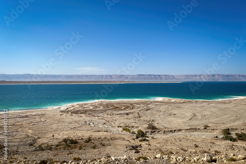 Scenic view of Dead Sea seen from Jordan looking towards Westbank against blue sky photo