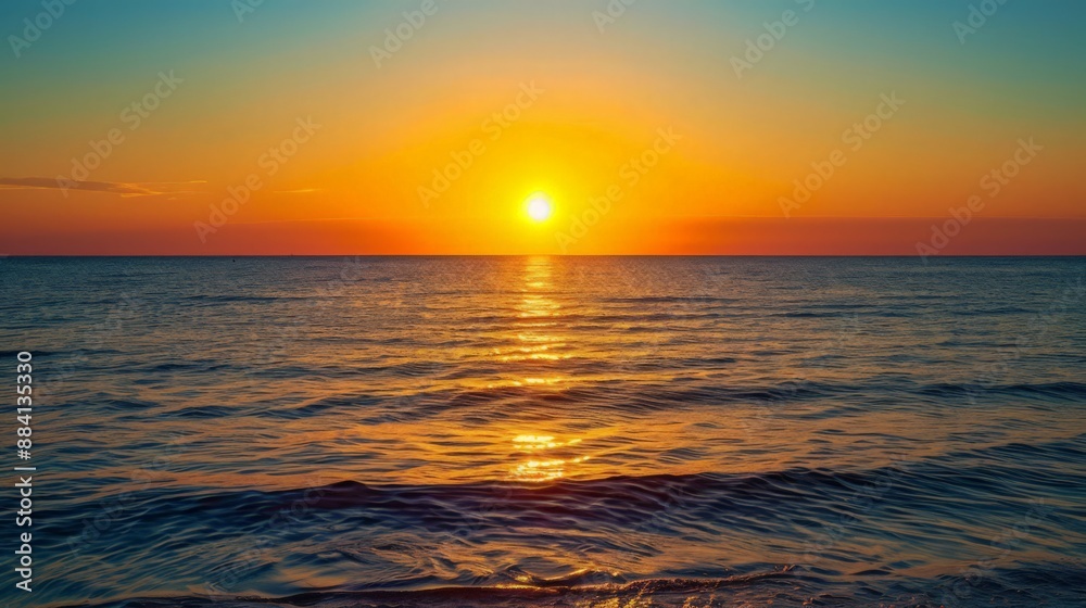 The sun sets on the horizon, creating a picturesque view over the sea. Let the calmness of the evening wash over you as the day ends The sun sets on the horizon, creating a picturesque view over the sea. Let the calmness of the evening wash over you as the day ends