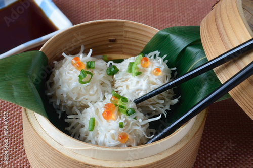 Ika Shumai is steamed squid dumplings made with the paste of squid from Hakodate mixed with ground pork filling, and covered with strips of thin shumai flour.