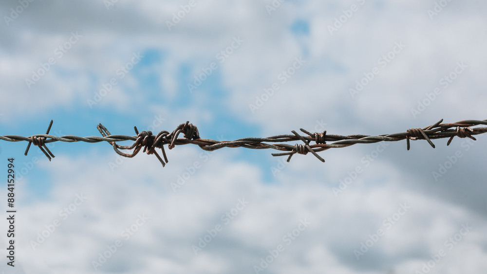 barbed wire against blue sky barbed wire against blue sky