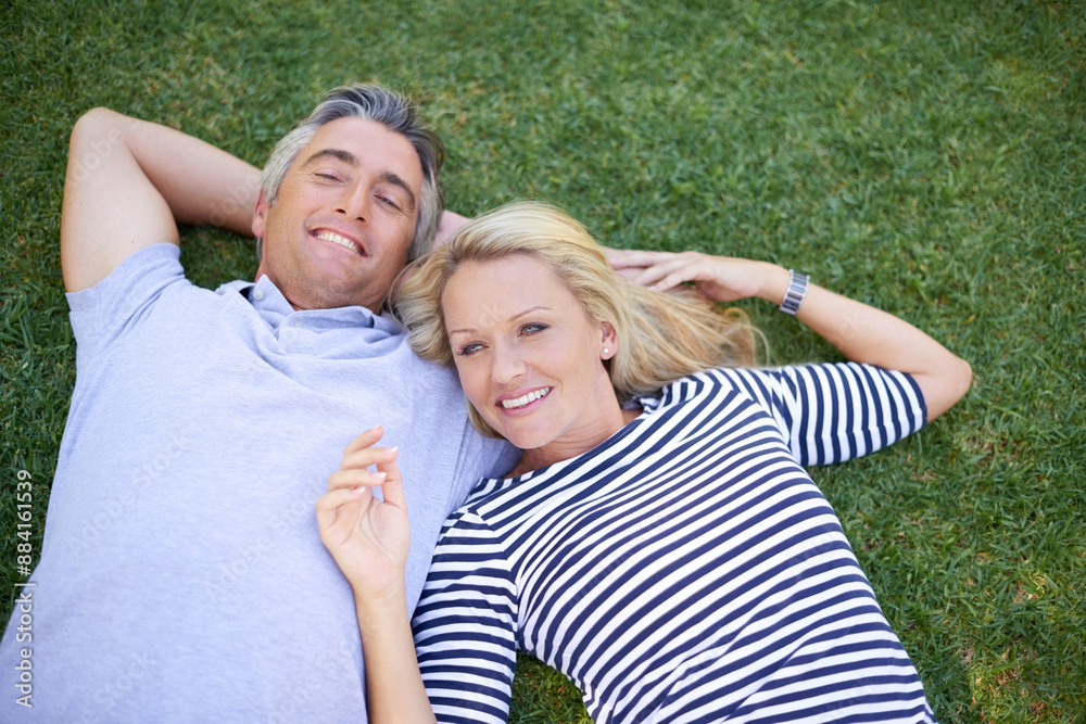 Relax, smile and couple on grass in park for romantic outdoor date with bonding and connection. Love, nature and people laying on green lawn in garden or field together with happiness in marriage. Relax, smile and couple on grass in park for romantic outdoor date with bonding and connection. Love, nature and people laying on green lawn in garden or field together with happiness in marriage.
