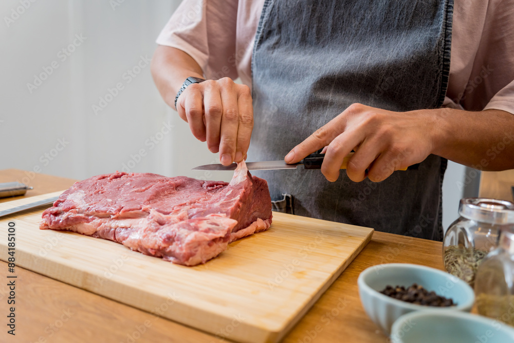 Raw fillet beef meat for steaks on the home electric grill Raw fillet beef meat for steaks on the home electric grill