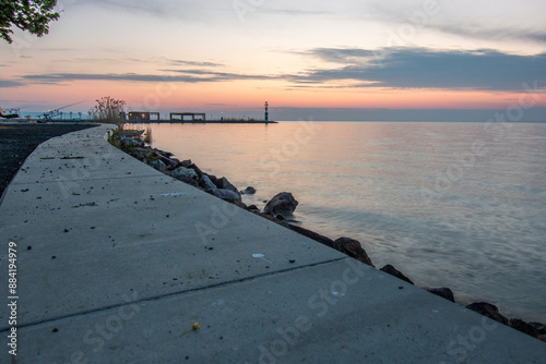 Sunrise on the shore and harbor of a lake in summer. Colorful sky with a wide view of the Horiont. Nature landscape at Tihany marina, Balaton, Lake Balaton, Siófok, Hungary photo