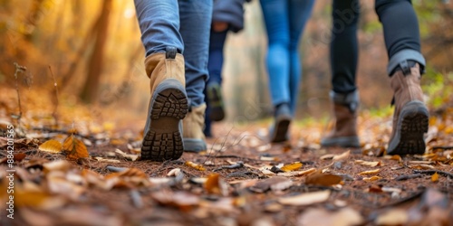 Group of Tourists Walking Along an Autumn Forest Path. Close-Up of Feet. Traveling in Small Groups for Fall Hike and Leisure during Vacation. AI-Generated 4K Wallpaper.