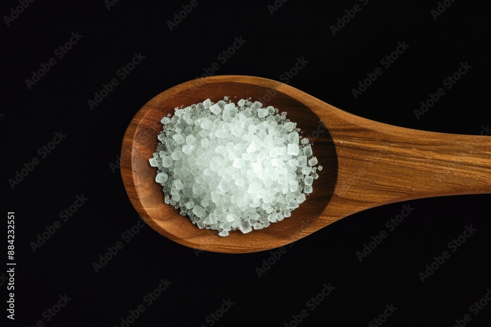 Isolated Wooden Spoon with White Sugar Crystals, Top View Isolated Wooden Spoon with White Sugar Crystals, Top View