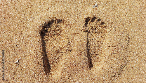 Footprint of a bare human foot in the beach sand
