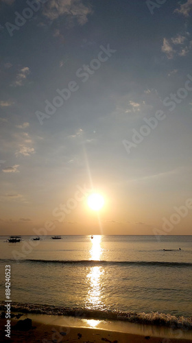 beautiful sunset at the beach with little waves