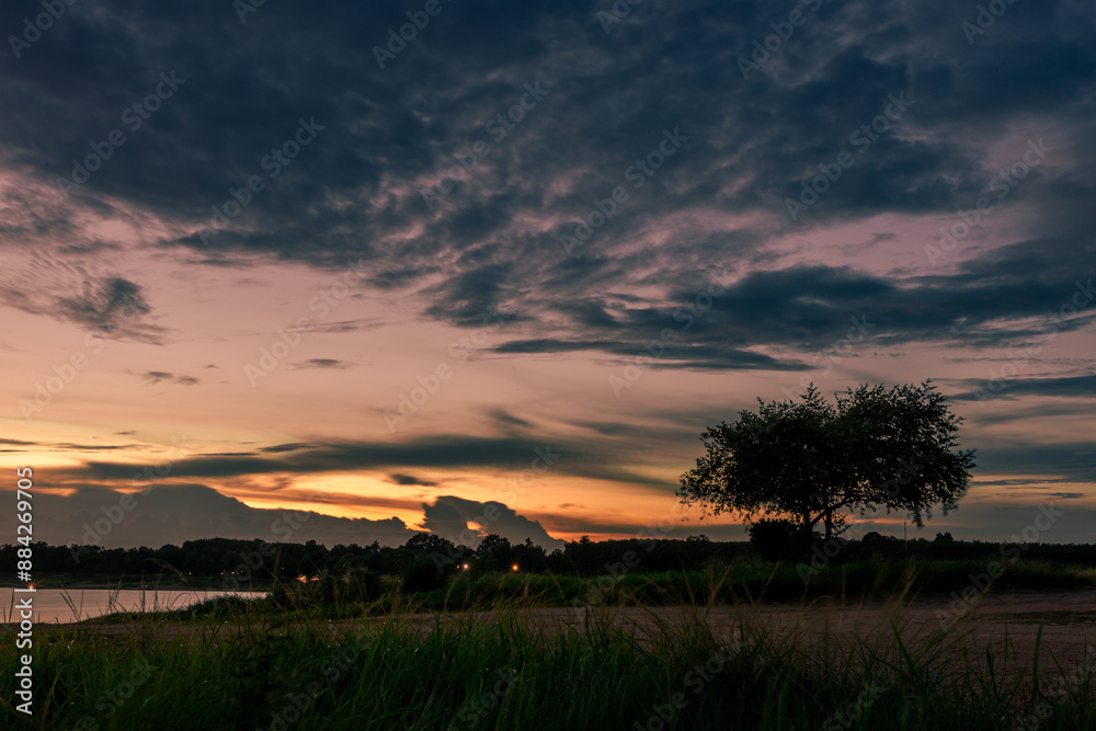 The background of the sea by the evening sea, with natural beauty (sea water, rocks, sky) and fishermen are fishing by the river bank, is a pleasure during travel.