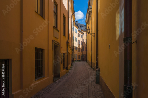 Stockholm Gamla stan, narrow cobbled street in the old town in summer with no people, Sweden