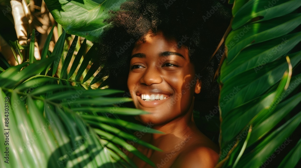 Joyful black woman with a genuine smile enveloped by dense green tropical leaves in a sun-dappled setting Joyful black woman with a genuine smile enveloped by dense green tropical leaves in a sun-dappled setting