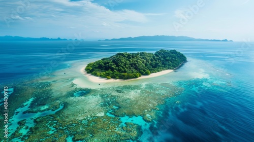 Aerial view of a tropical island with white sandy beaches and vibrant coral reefs