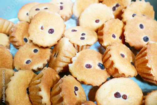 Pile of Delectable Freshly Baked Khanom Farang Kudeejeen, a Famous Portuguese Influenced Cupcakes in Bangkok, Thailand photo