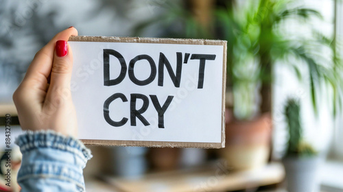 Don`t Cry. The inscription on white sheet of paper. Emotional outburst photo