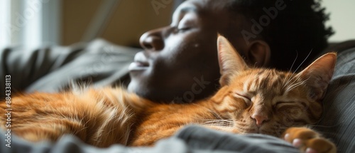 Black man relaxing on the couch with his purring cat, a serene indoor moment