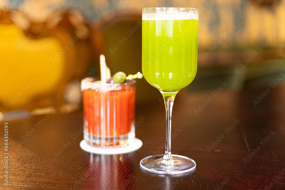 red and green cocktails on the table in the establishment red and green cocktails on the table in the establishment
