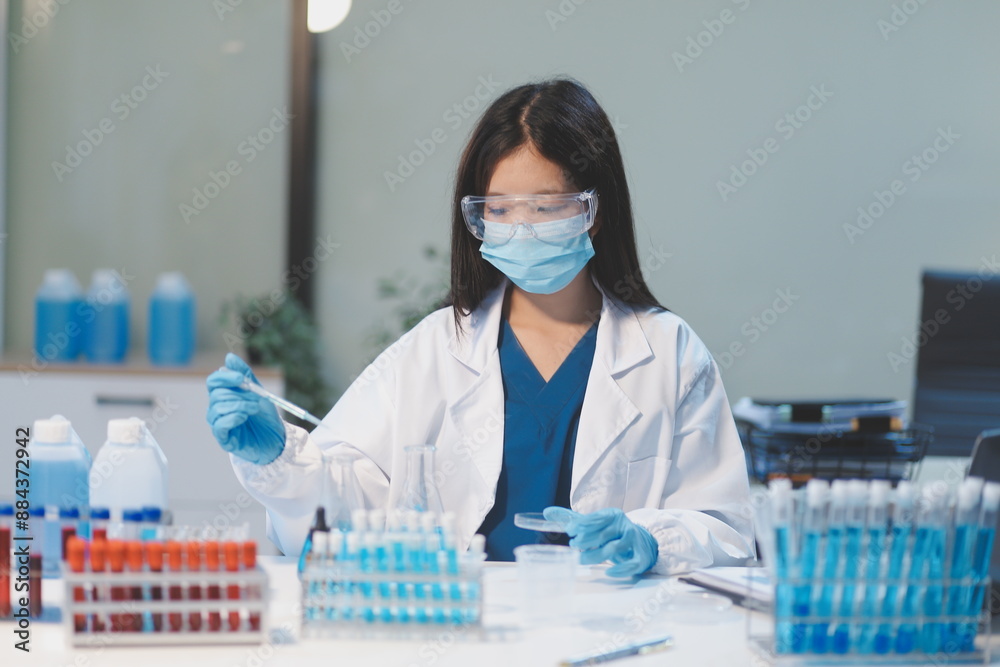 Group of dedicated scientist conduct chemical experiment in medical laboratory, carefully drop precise amount of liquid from pipette into test tube for vaccine drug or antibiotic development. Neoteric Group of dedicated scientist conduct chemical experiment in medical laboratory, carefully drop precise amount of liquid from pipette into test tube for vaccine drug or antibiotic development. Neoteric