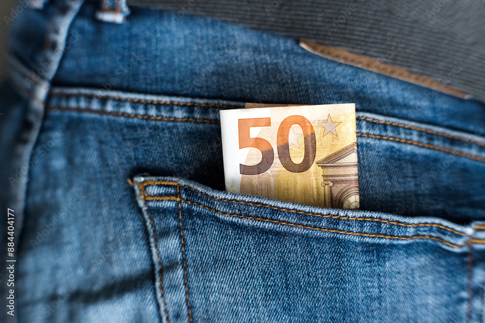 Euro, money in jeans pocket. Savings for a rainy day.