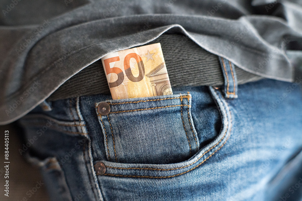 Euro, money in jeans pocket. Savings for a rainy day.