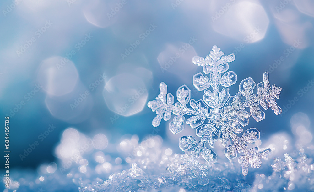 Close-up of a snowflake on a bed of glittering snow. Close-up of a snowflake on a bed of glittering snow.