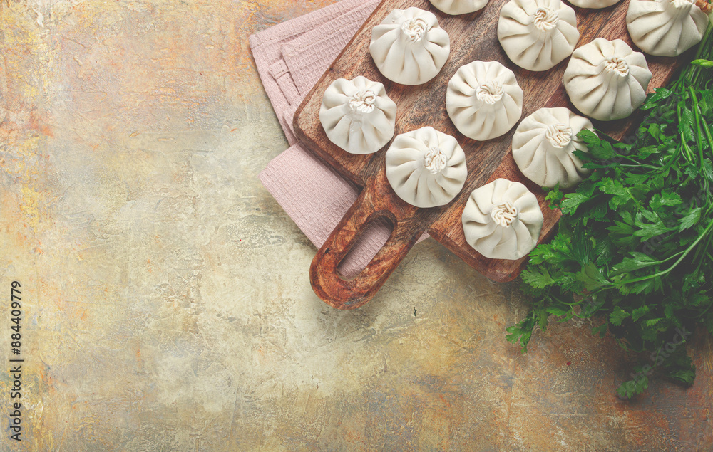 freshly frozen raw khinkali, on a wooden chopping board, top view, Georgian cuisine, no people, freshly frozen raw khinkali, on a wooden chopping board, top view, Georgian cuisine, no people,
