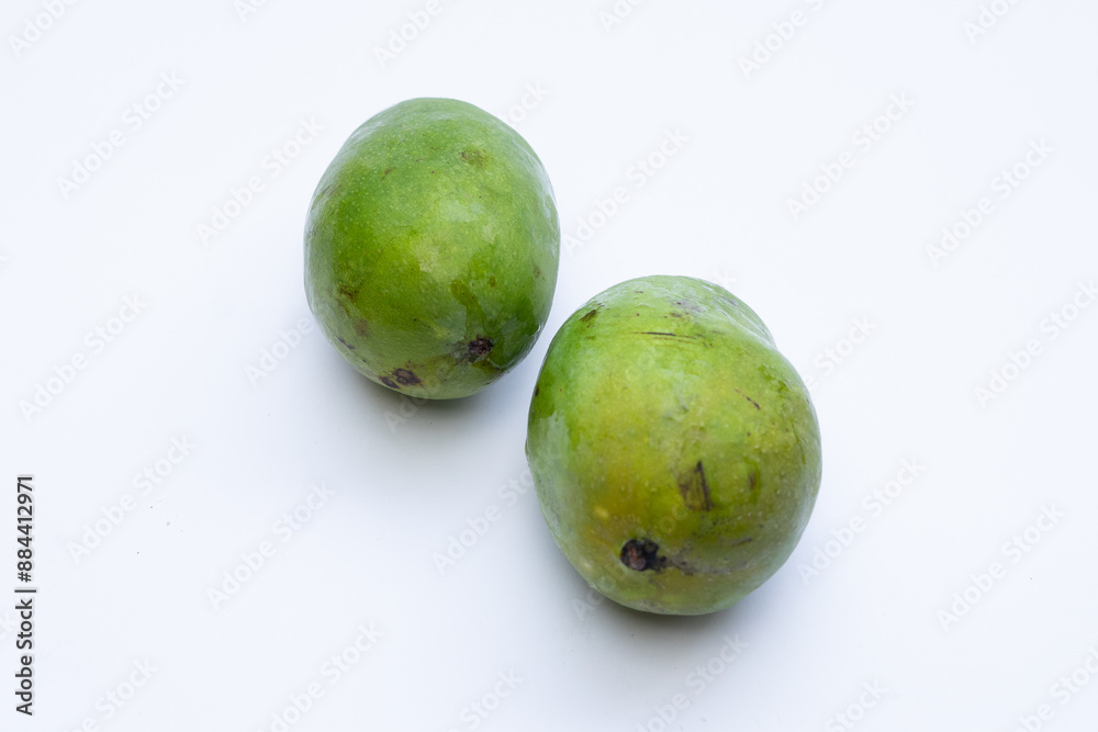 Fresh mango fruit on a white background, highlighting its vibrant yellow color and smooth texture, perfect for food photography and advertising Fresh mango fruit on a white background, highlighting its vibrant yellow color and smooth texture, perfect for food photography and advertising