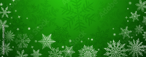 Christmas background of beautiful complex snowflakes located below, white on green colors. Winter illustration with falling snow.