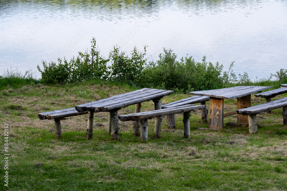 Wooden tables and chairs for sitting by the lake. Vlasina Lake.
Wooden tables and chairs for sitting by the lake. Vlasina Lake.
