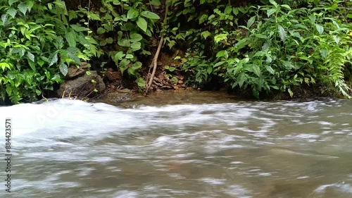 water flow in the river with small waves created, water background