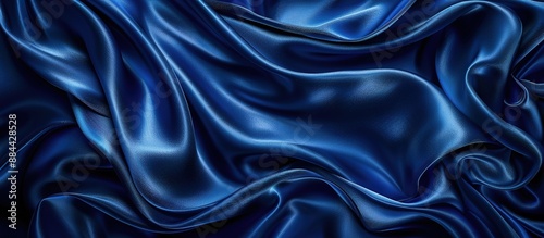 A background made of wavy strands of blue satin fabric