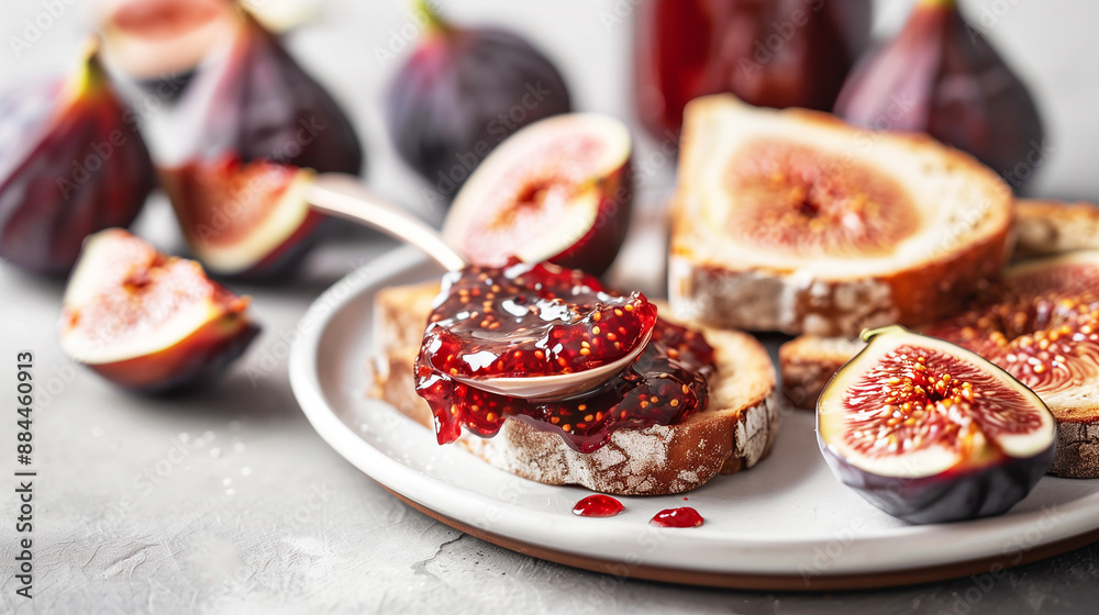 Close-up of fig jam with fresh figs and toast. A close-up image featuring a spoon spreading fig jam on a slice of toast, surrounded by fresh figs. Close-up of fig jam with fresh figs and toast. A close-up image featuring a spoon spreading fig jam on a slice of toast, surrounded by fresh figs.