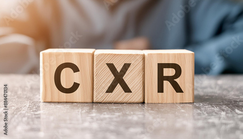 Wooden cubes with abbreviation CXR on table. Chest X-Ray. Medical concept, diagnostic and laboratory photo