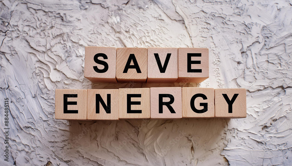 Wooden cubes with text SAVE ENERGY on cement background. Top view. Wooden cubes with text SAVE ENERGY on cement background. Top view.