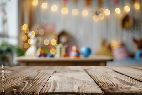 Empty wooden table top and blurred kids room interior on the background. object, product, toy presentation