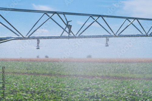 Modern agricultural irrigation system spraying in field