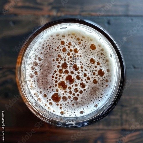 carling pint glass. photo taken from the top. BEER IS FLAT photo