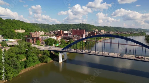 WEST VIRGINIA - 6.24.2024 - Good aerial footage moving over bridges on the Monongahela River and into Wheeling, West Virginia.