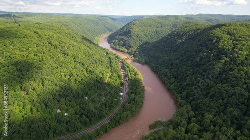 WEST VIRGINIA - 7.5.2024 - Excellent aerial footage moving alongside the New River and its nearby railroad in West Virginia. photo