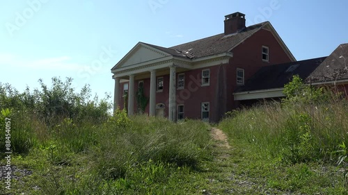 USA - 7.5.2024 - Low-angle exterior of an abandoned plantation mansion in the rural American south.