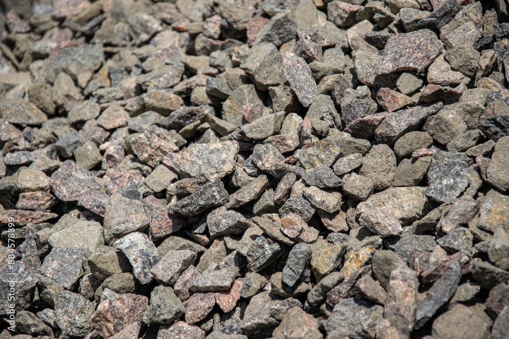 A close up view of a pile of gray crushed stone gravel