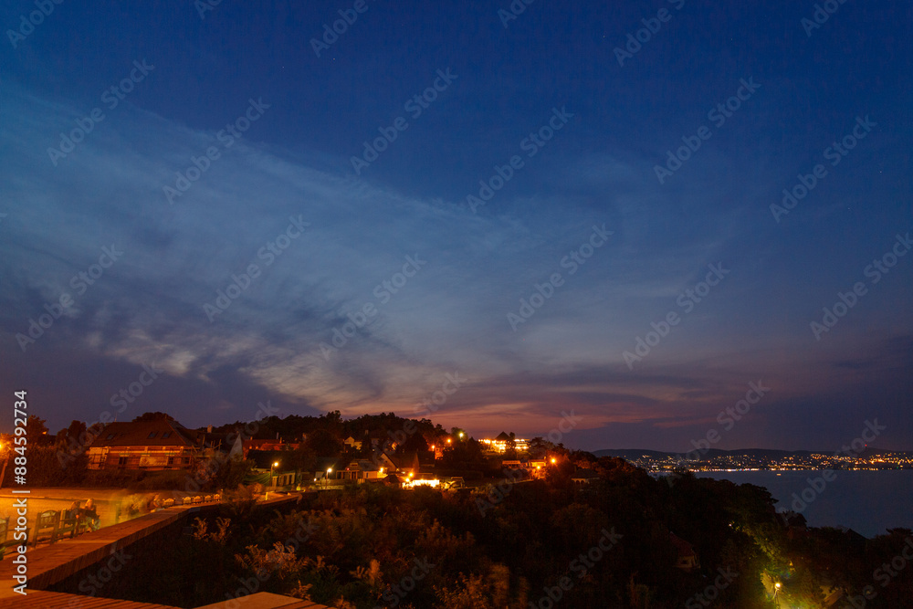 Obraz premium Noctilucent clouds over the skies of Balaton in Tihany near the church.