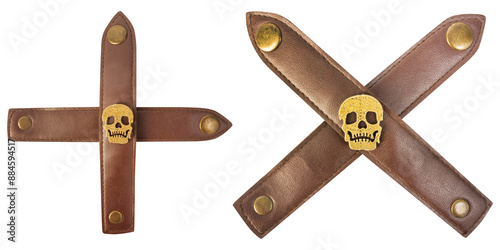 Tablou pe pânză Isolated png photo of brown colored leather crossed straps with skull rivet ornaments and brass rivets on transparent background