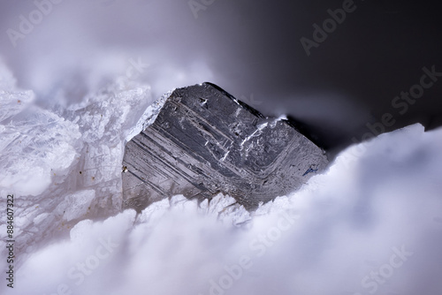 Native bismuth on white chondrodite. Micro photography extreme close-up. Specimen from Conchita Mine, Spain. microscope photography for Scientific use.
 photo
