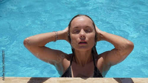 Girl relaxing in the pool 