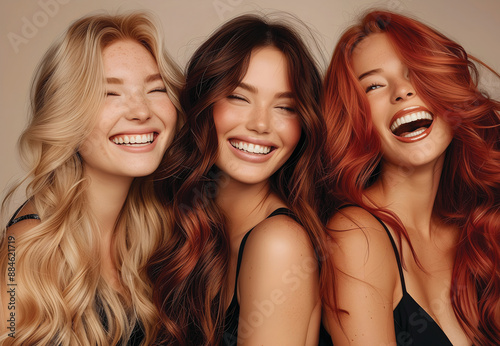 Three smiling models with red, burnette and blonde hair  photo