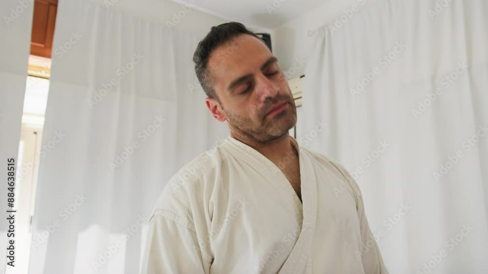 Adult Man Making Neck Warm up With Karate Uniform Adult Man Making Neck Warm up With Karate Uniform