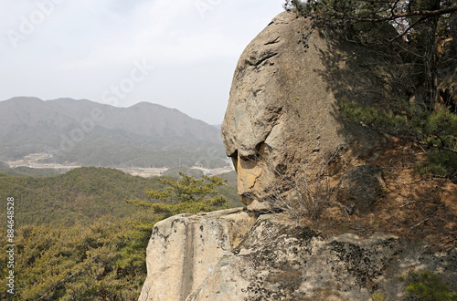 High angle view of a Maitreya Rock shaped like a human face on the cliff of Songnisan Mt of Unheung-ri near Sangju-si, South Korea
 photo