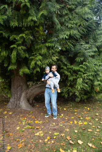 Young father with his son in the autumn park. The concept of a happy family. © Kateryna