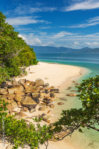 Picturesque tropical golden Nudey Beach with turquoise water on Fitzroy Island. It is a continental island southeast of Cairns, Queensland, Australia. photo