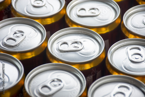 macro photography of wet canned beer lids