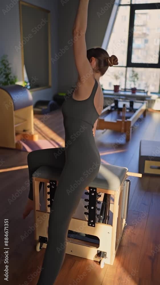 Woman doing mermaid exercise in a sunlit, modern studio, embodying calm, focus, and strength. Woman doing mermaid exercise in a sunlit, modern studio, embodying calm, focus, and strength.